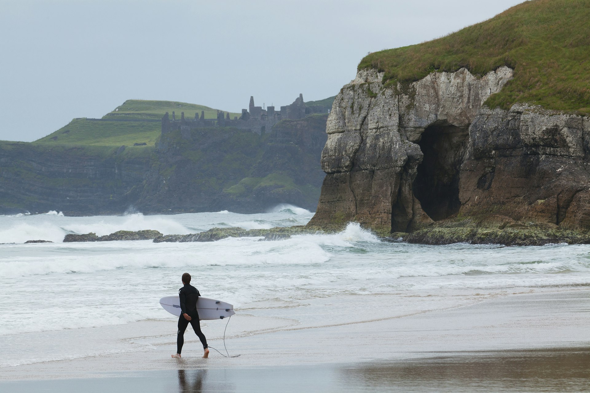Surfer hitting the waves at a beach near Portrush