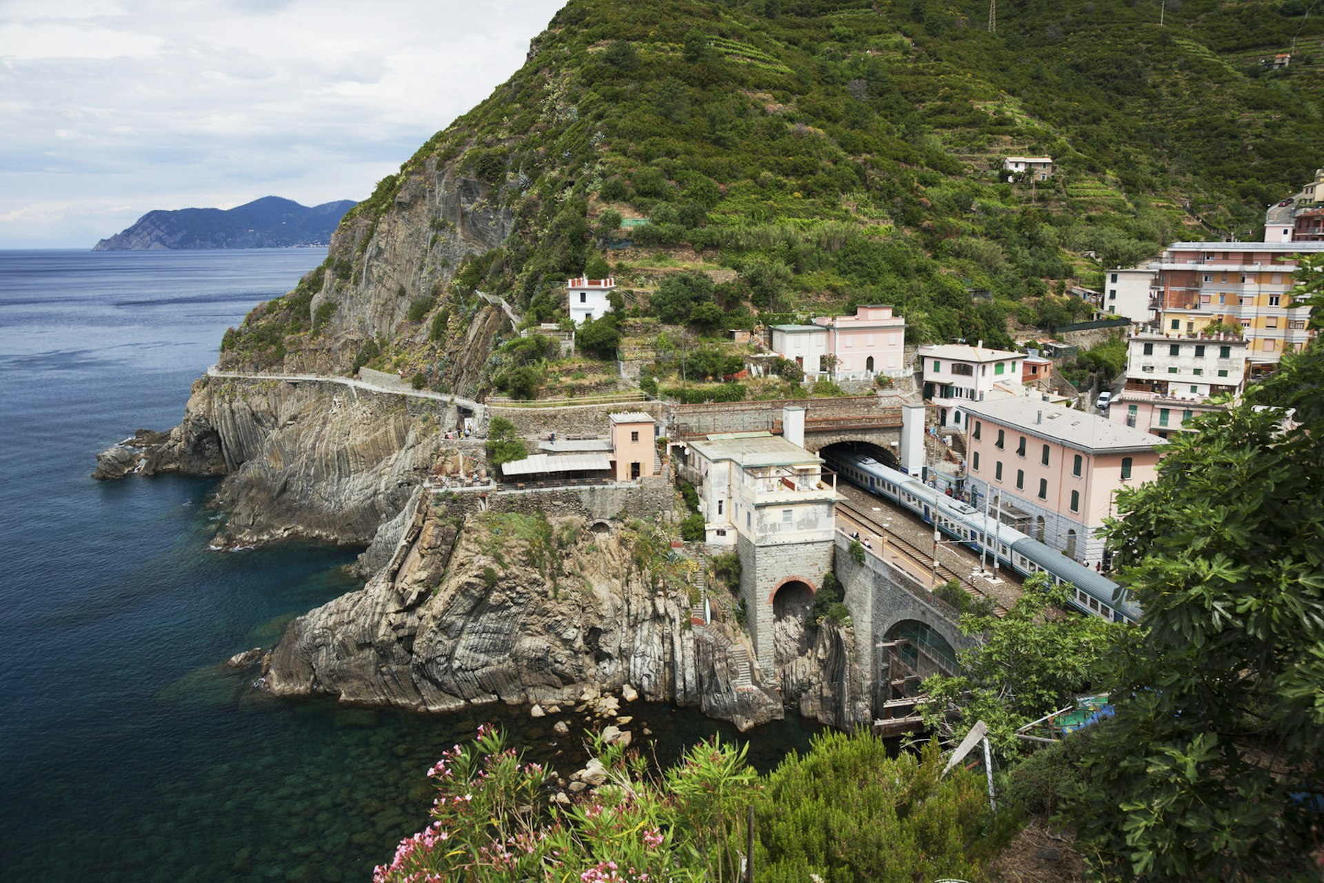 Train passing through a tunnel on the Cinque Terre coast near Riomaggiore