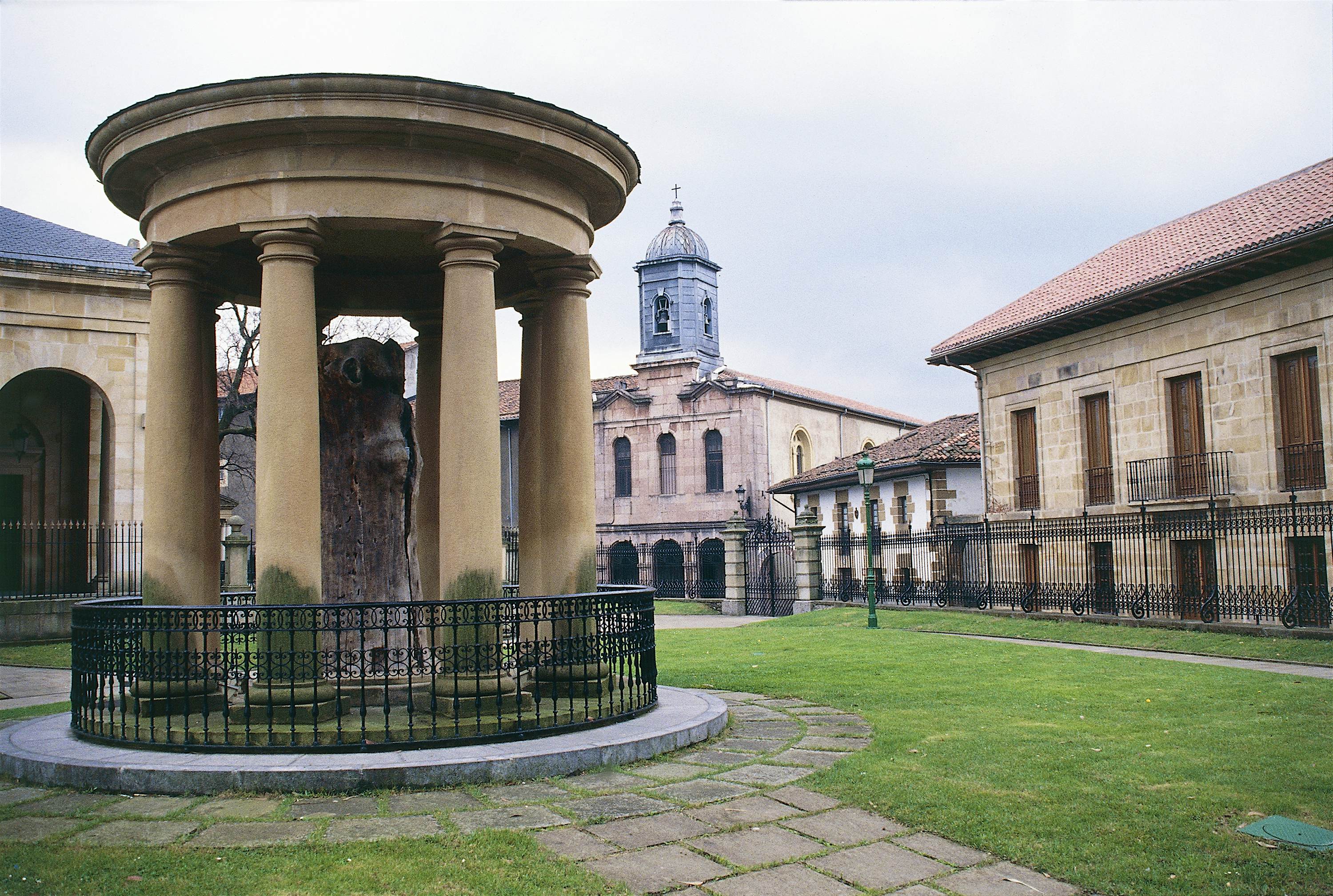 Features - Temple with the remains of tree of Guernica, under which noblemen gathered in Middle Ages, symbol of freedom for Basques, Guernica, Basque Country, Spain A stone temple surrounds the remains of the tree of Guernica, under which noblemen gathered in the Middle Ages; visit Basque country