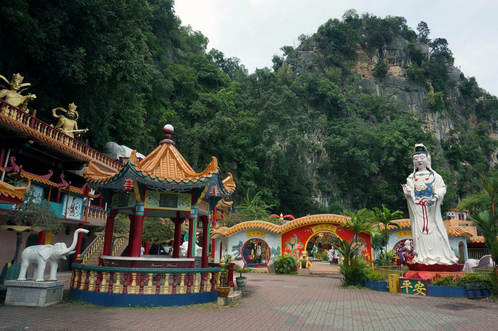 A pantheon in technicolour at Ling Sen Tong temple © Anita Isalska / Lonely Planet