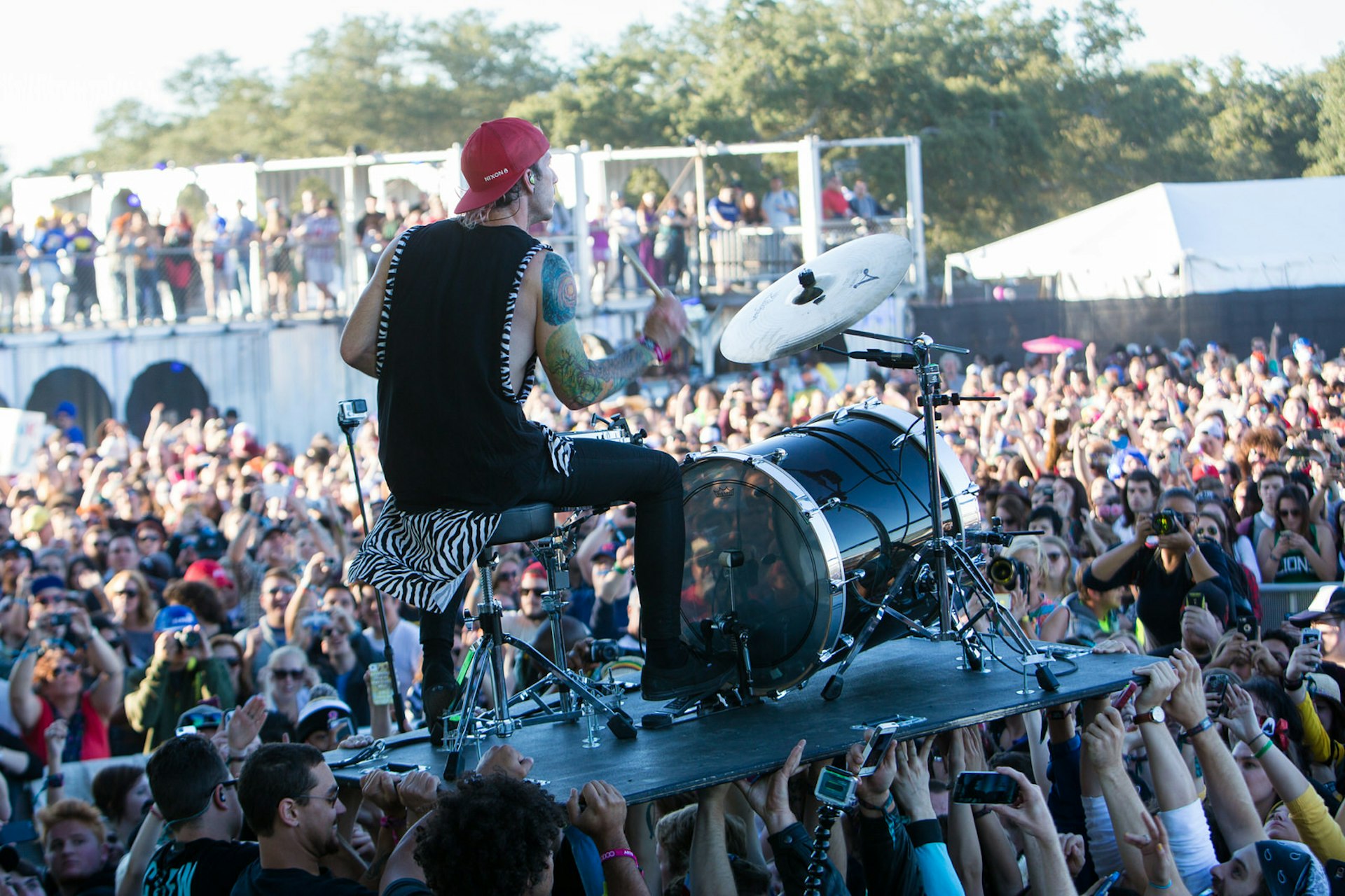 NEW ORLEANS, LA - OCTOBER 31: Josh Dun of Twenty One Pilots performs in the crowd during the 2014 Voodoo Music + Arts Experience at New Orleans City Park on October 31, 2014 in New Orleans, Louisiana. (Photo by Josh Brasted/FilmMagic)