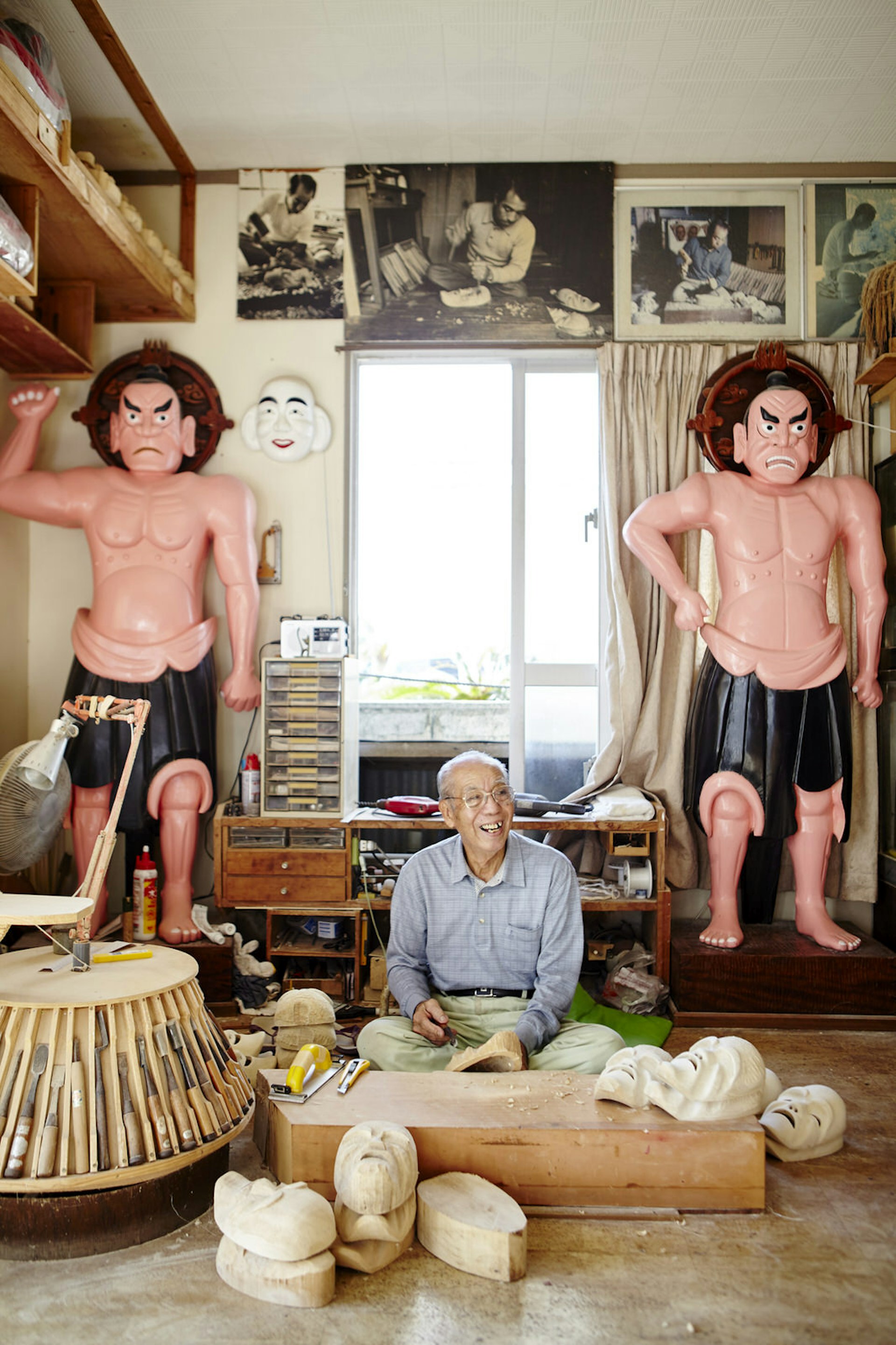83-year-old Yusei Taba has been making masks since the age of 27; here in his workshop, he is surrounded by his craft and photos of him hard at work © Matt Munro / Lonely Planet