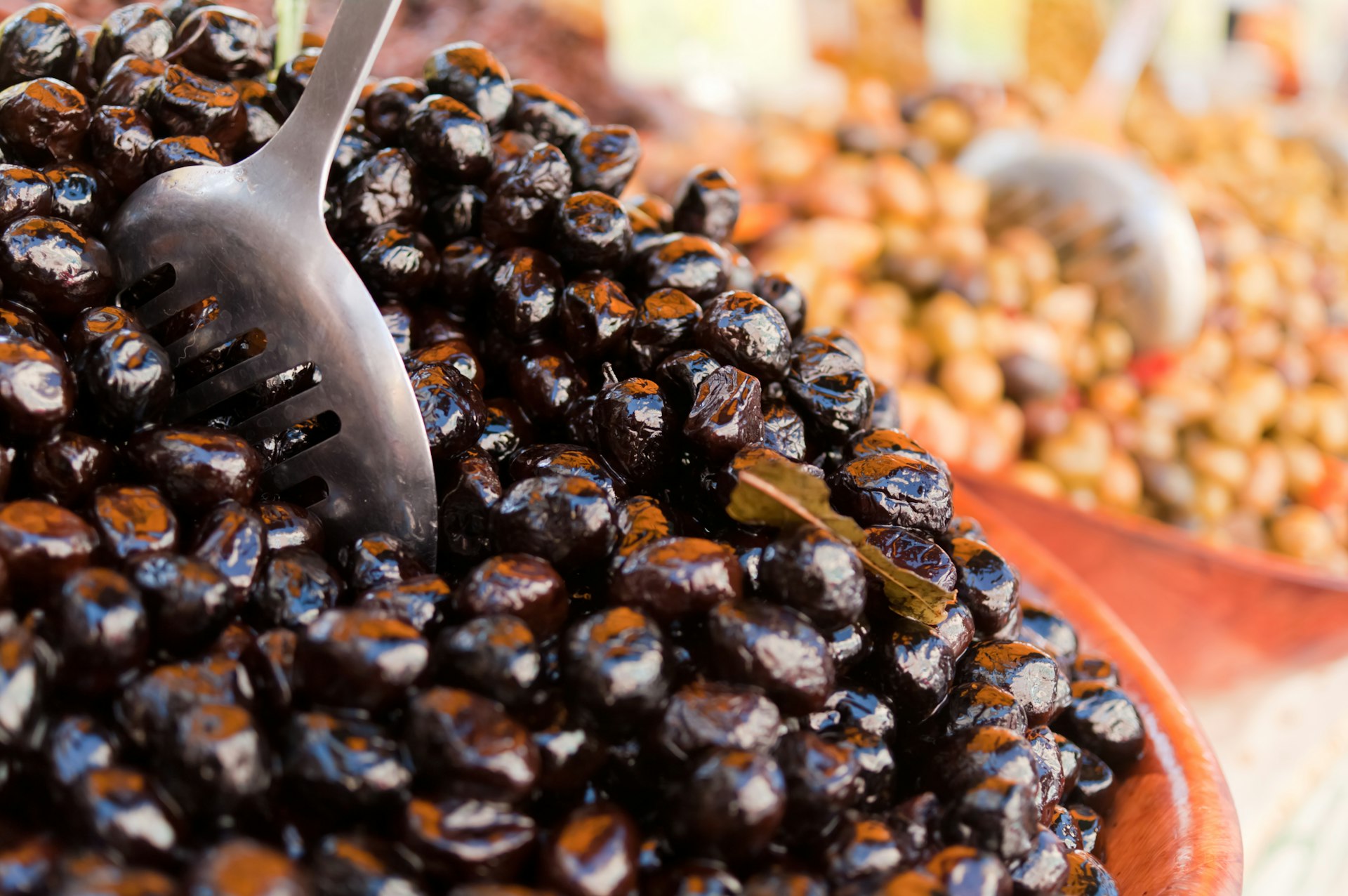 Black olives on a French market stall. Image © G. G. Bruno / Moment / Getty