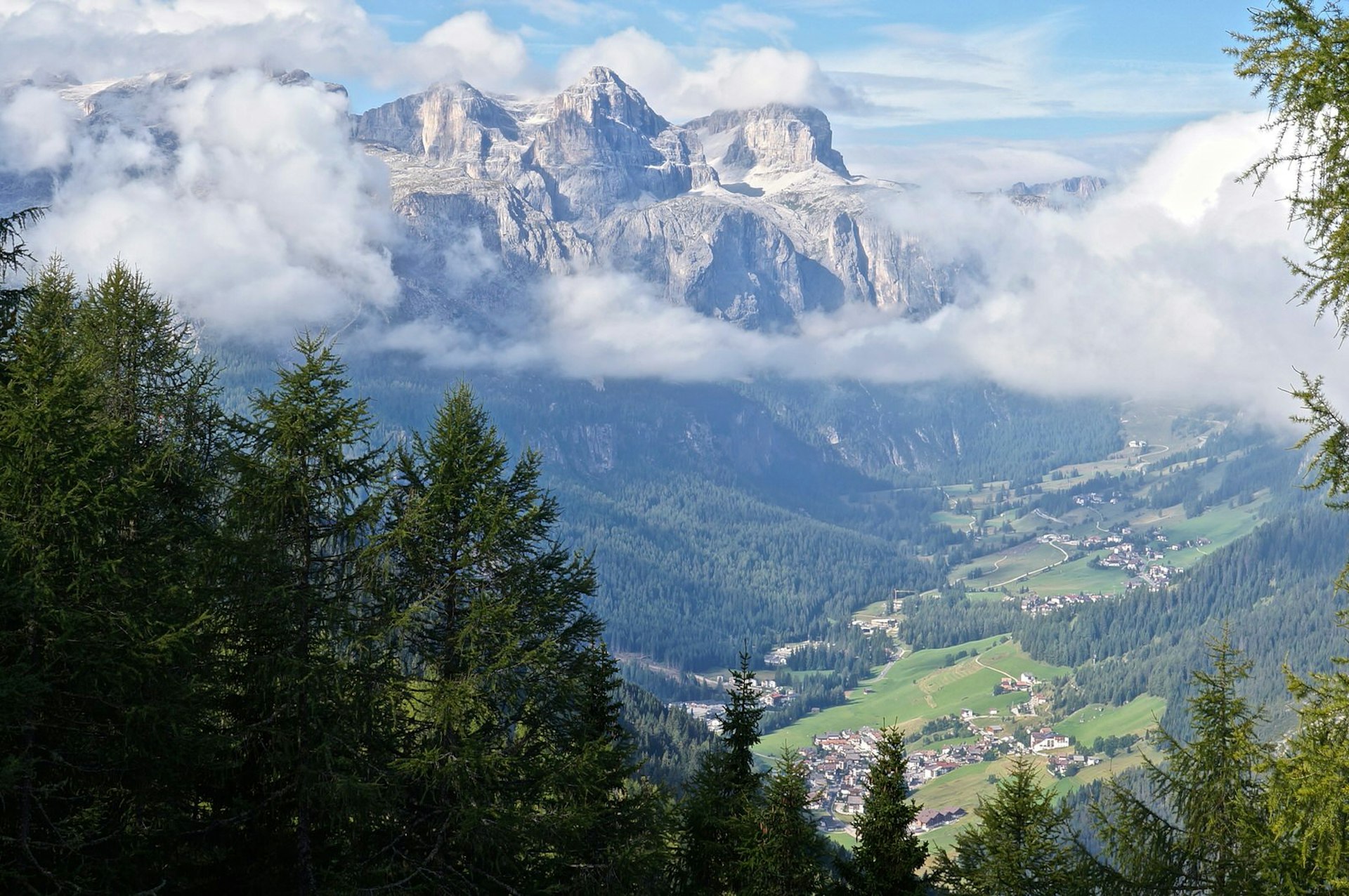 The dramatic Dolomites mountains tower over the Alta Badia valley