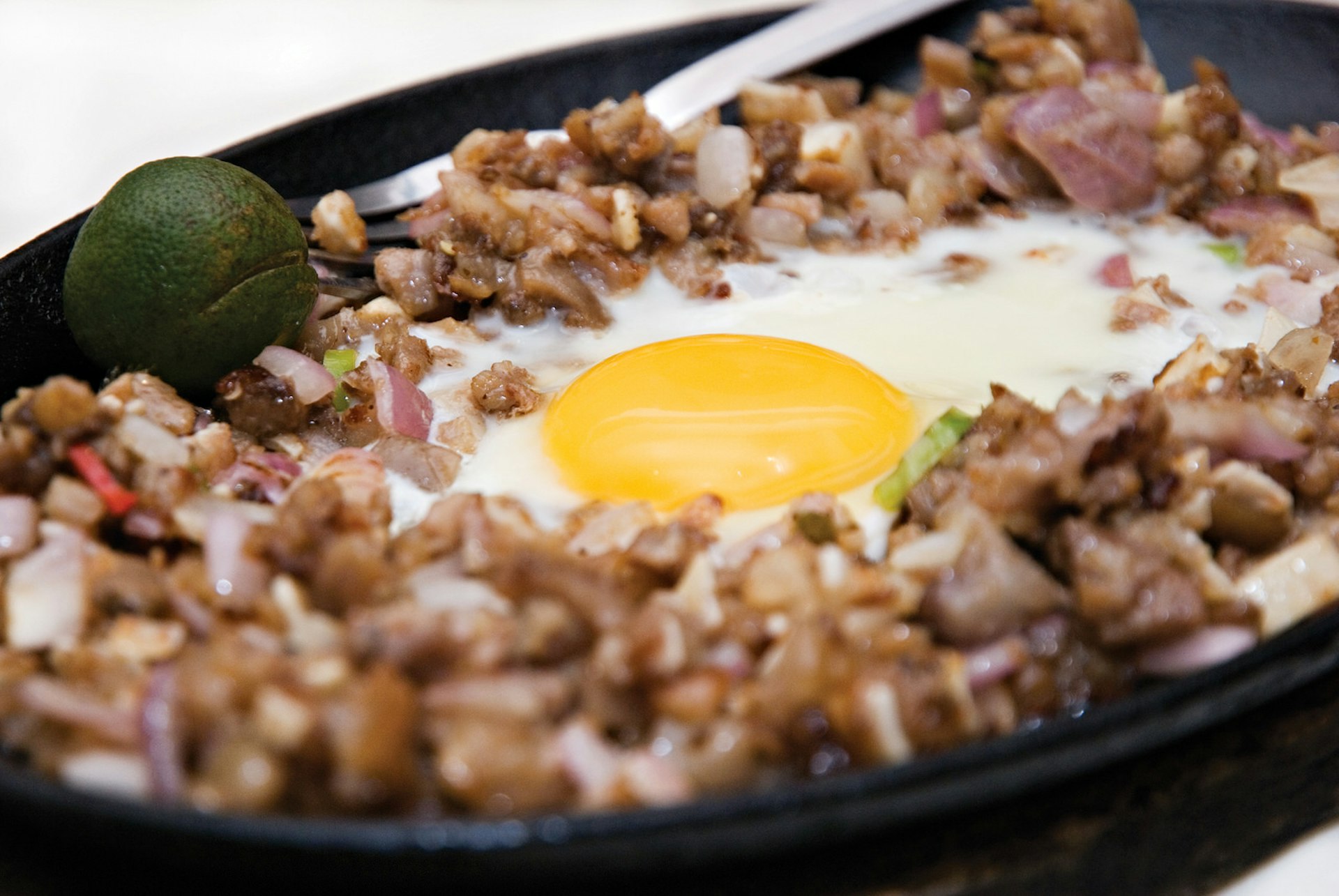 Sizzling sisig with raw egg