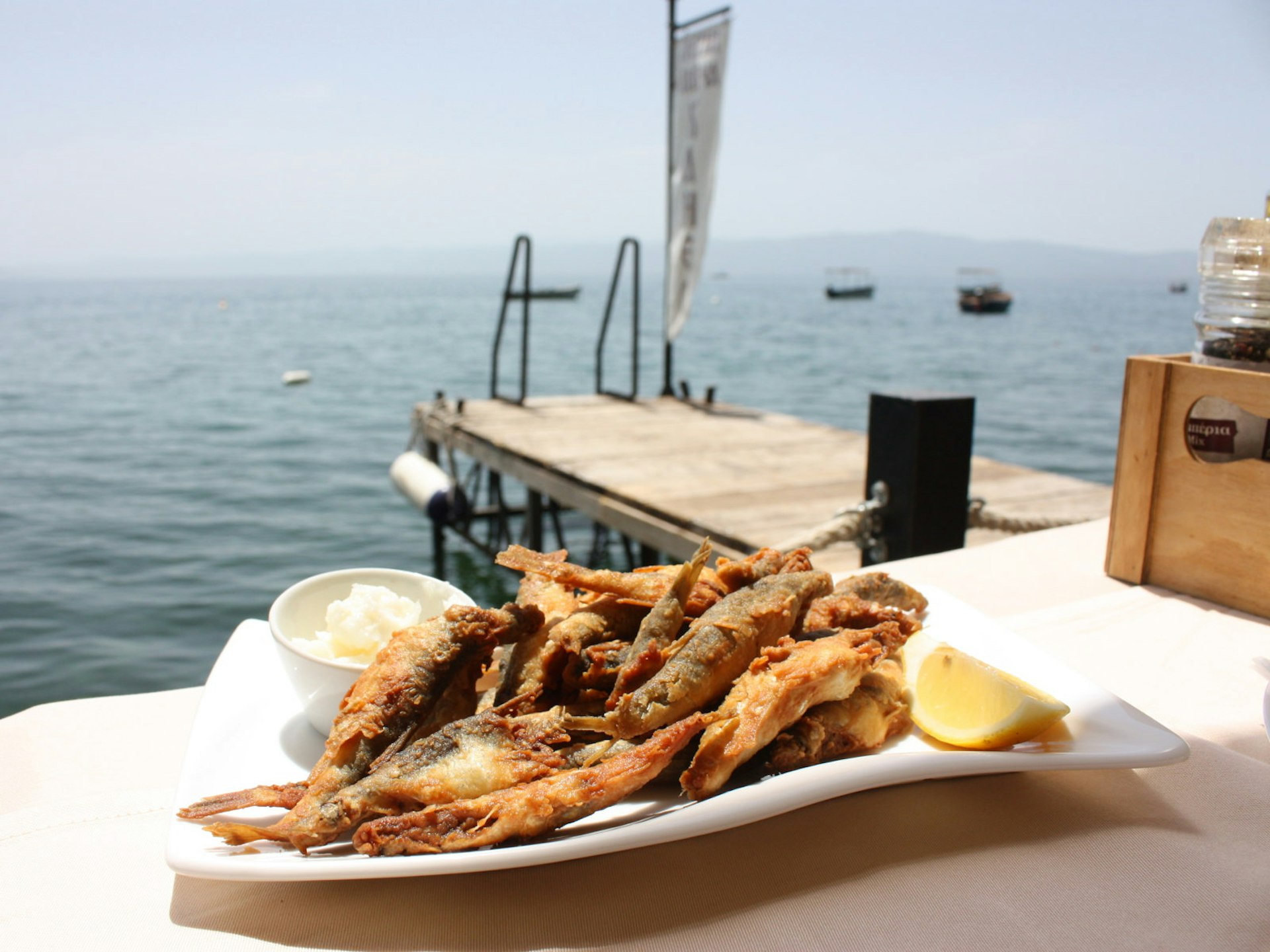 Plasnica fish lunch at Letna Bavča Kaneo © Lorna Parkes / Lonely Planet