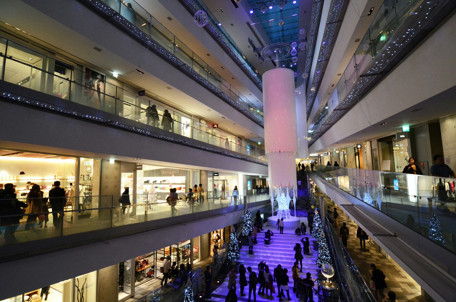 People shopping at the multi-storey Omotesandō Hills shopping complex