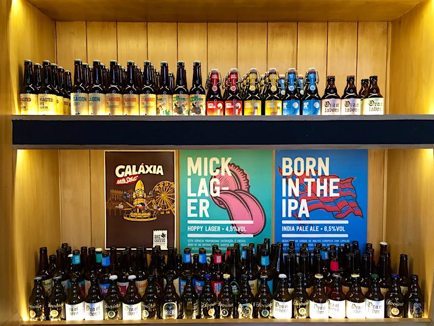 Features - 3-beer-station Portuguese craft beers line the walls at Beer Station © Kevin Raub / Lonely Planet