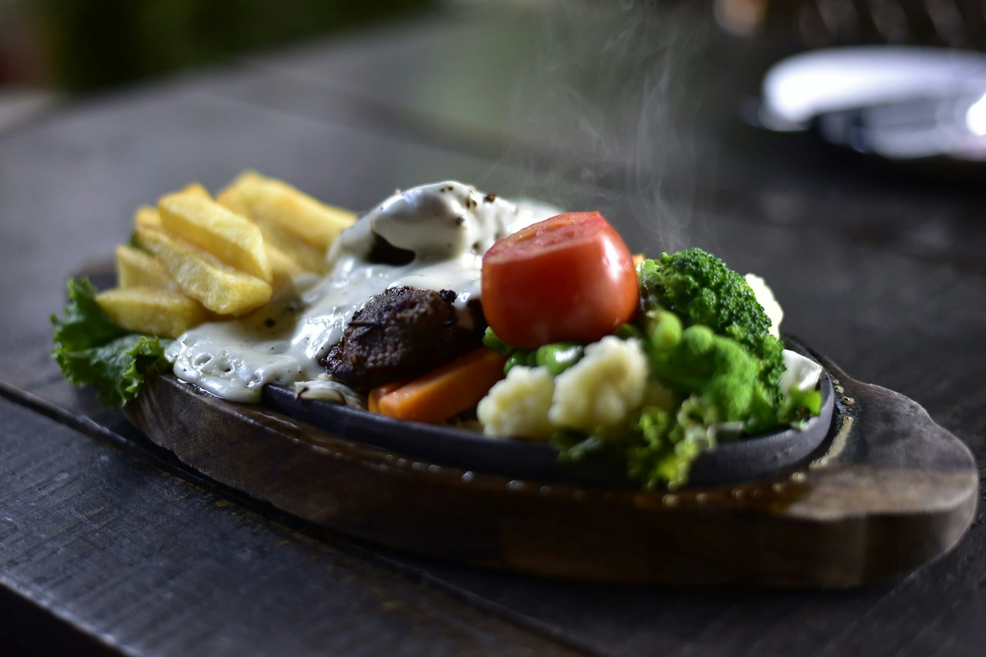 Steaks in Nepal are serve sizzler-style, on a heated cast-iron platter © Sirin Meesorn/Getty Images