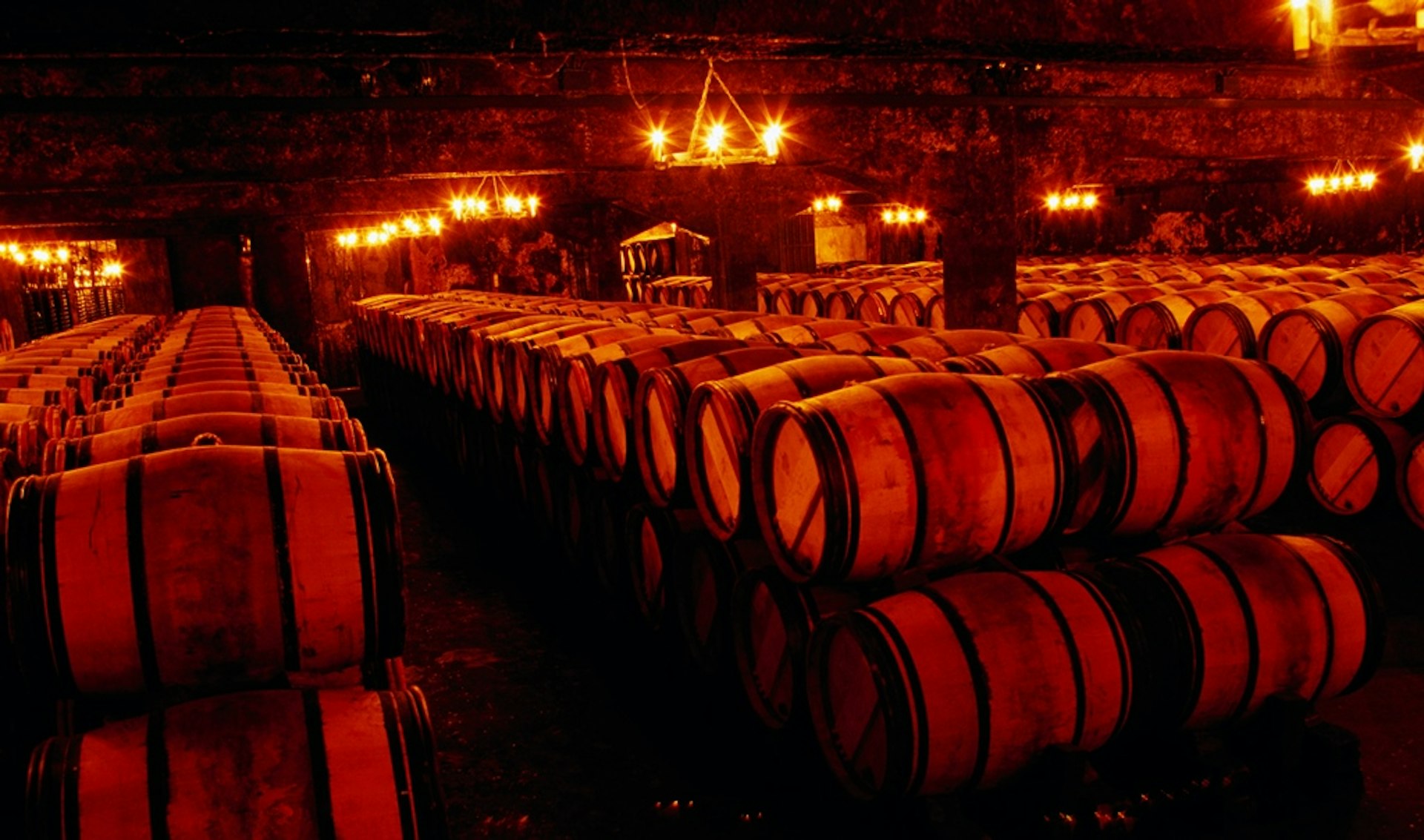 Explore the cellars of a historic chateaux. Image © Oliver Strewe / Lonely Planet Images / Getty
