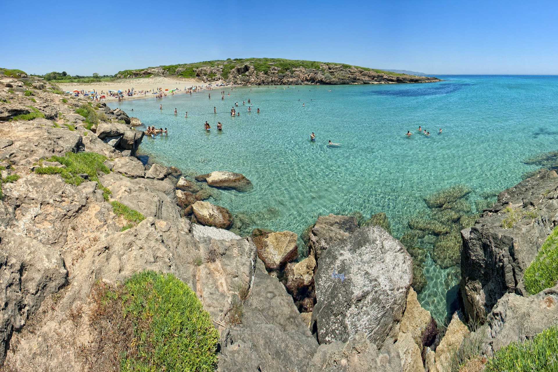 Idyllic Calamosche beach awaits at the end of your hike