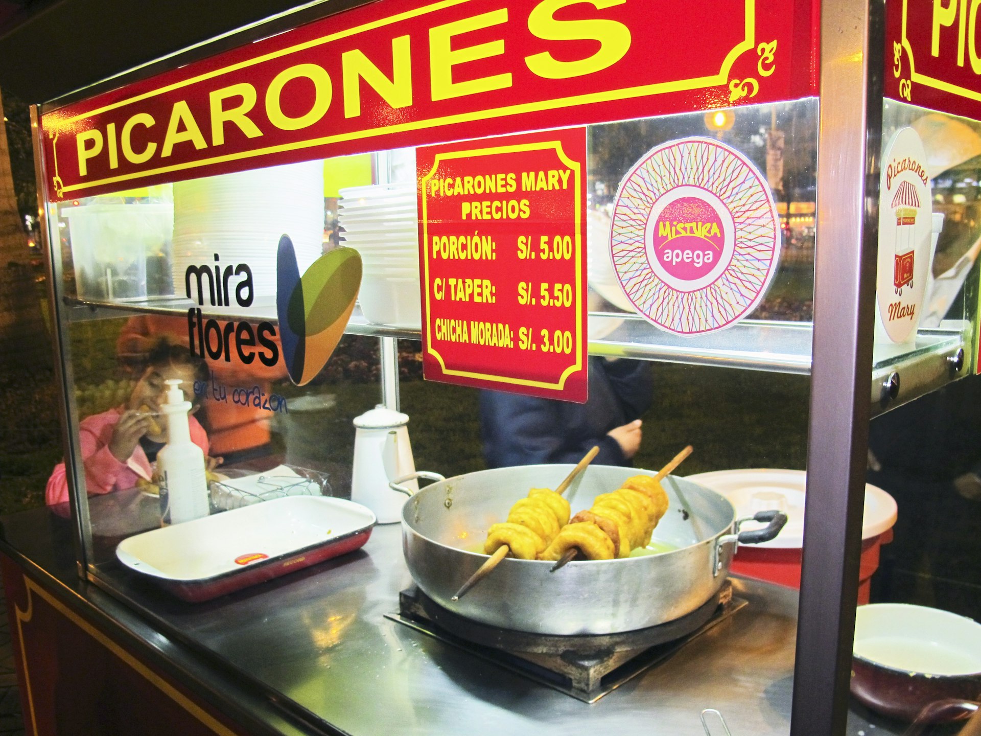 Vegetable donuts? Sort of. Picarones are hot and ready in Parque Kennedy © Agnes Rivera / Lonely Planet