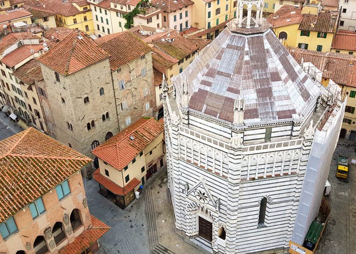 The octagonal 14th-century Baptistery amid the red pan-tiled roofs of Pistoia, Italy © Emma Sparks / Lonely Planet