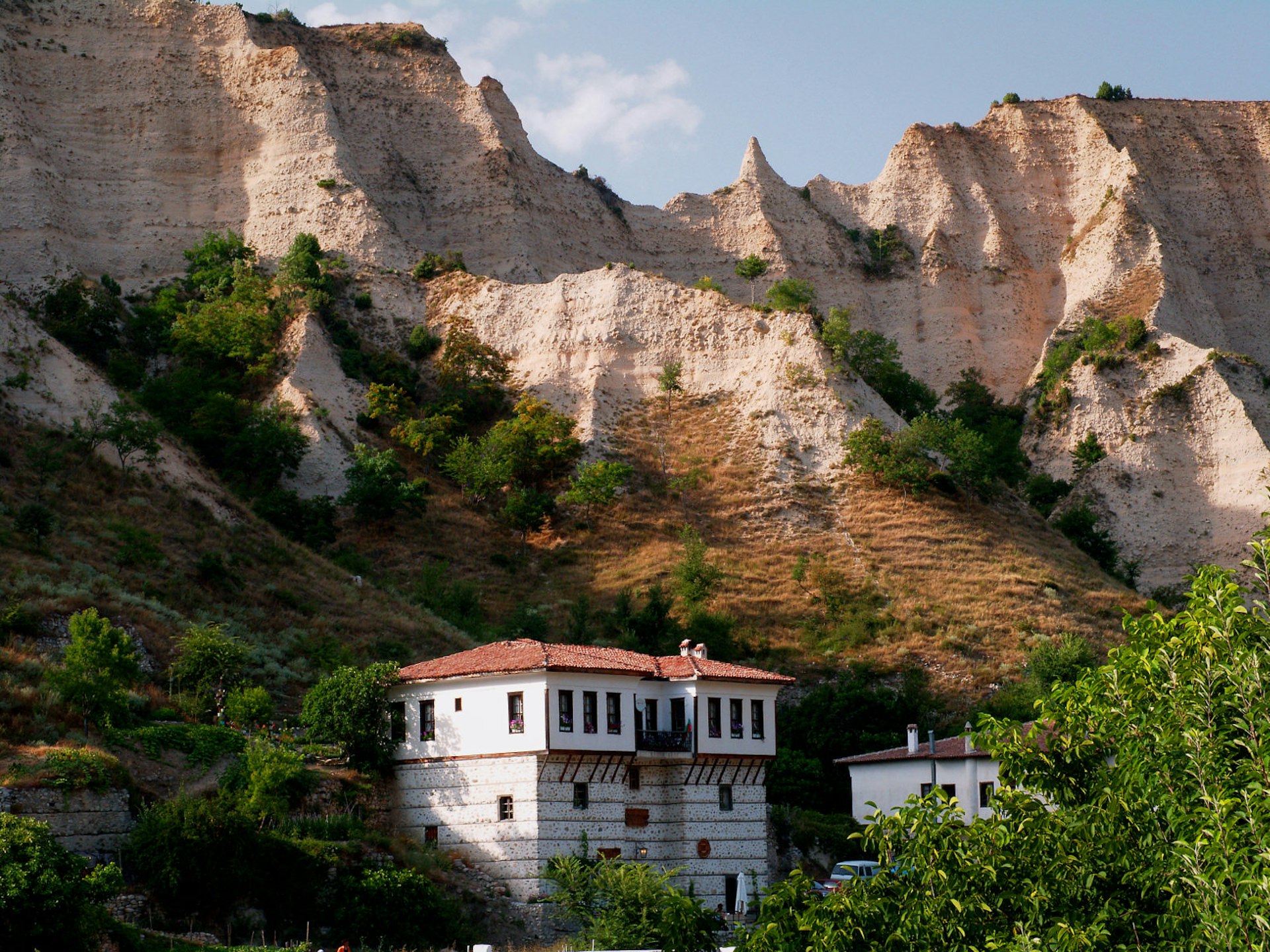 Sandstone pyramids rising over Melnik’s traditional houses 