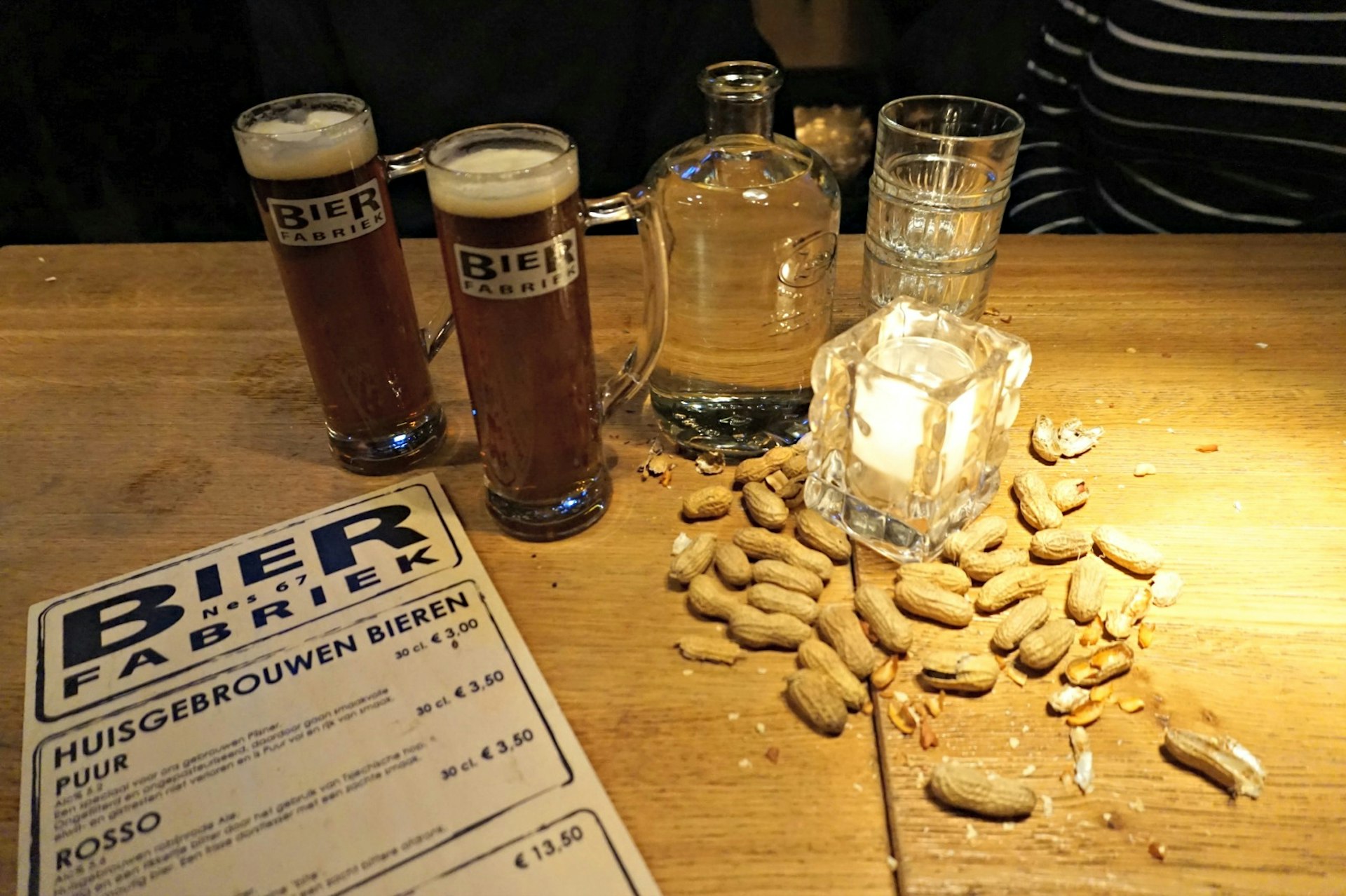 Craft beer and all the peanuts you can eat at Bierfabriek © Claire Bissell / Lonely Planet