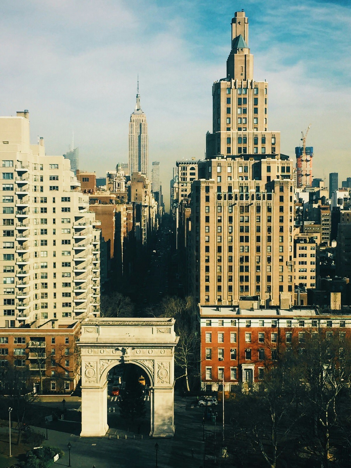 Get on a different level (or storey) to capture a different perspective of major must-sees; this 2-for-1 features New York City's Washington Square Arch in the foreground and the Empire State Building further afield © MaSovaida Morgan / Lonely Planet