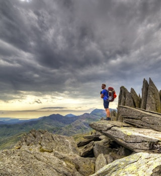A hiker surveys Snowdonia from Glyder Fach © Sebastien Coell / Shutterstock