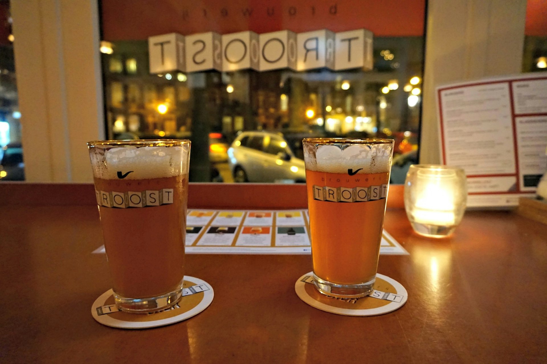Spend a cosy candlelit evening at Brouwerij Troost © Claire Bissell / Lonely Planet