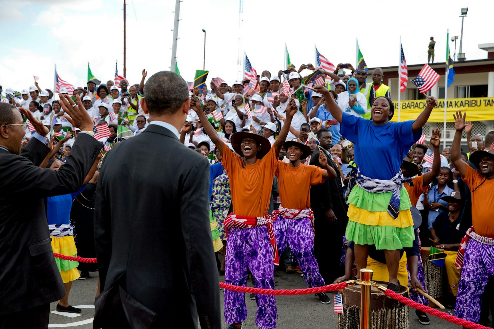 President Obama watching performers on the tarmac at Julius Nyerere International Airport in Dar es Salaam, Tanzania, July 2, 2013 © Pete Souza / Official White House Photo