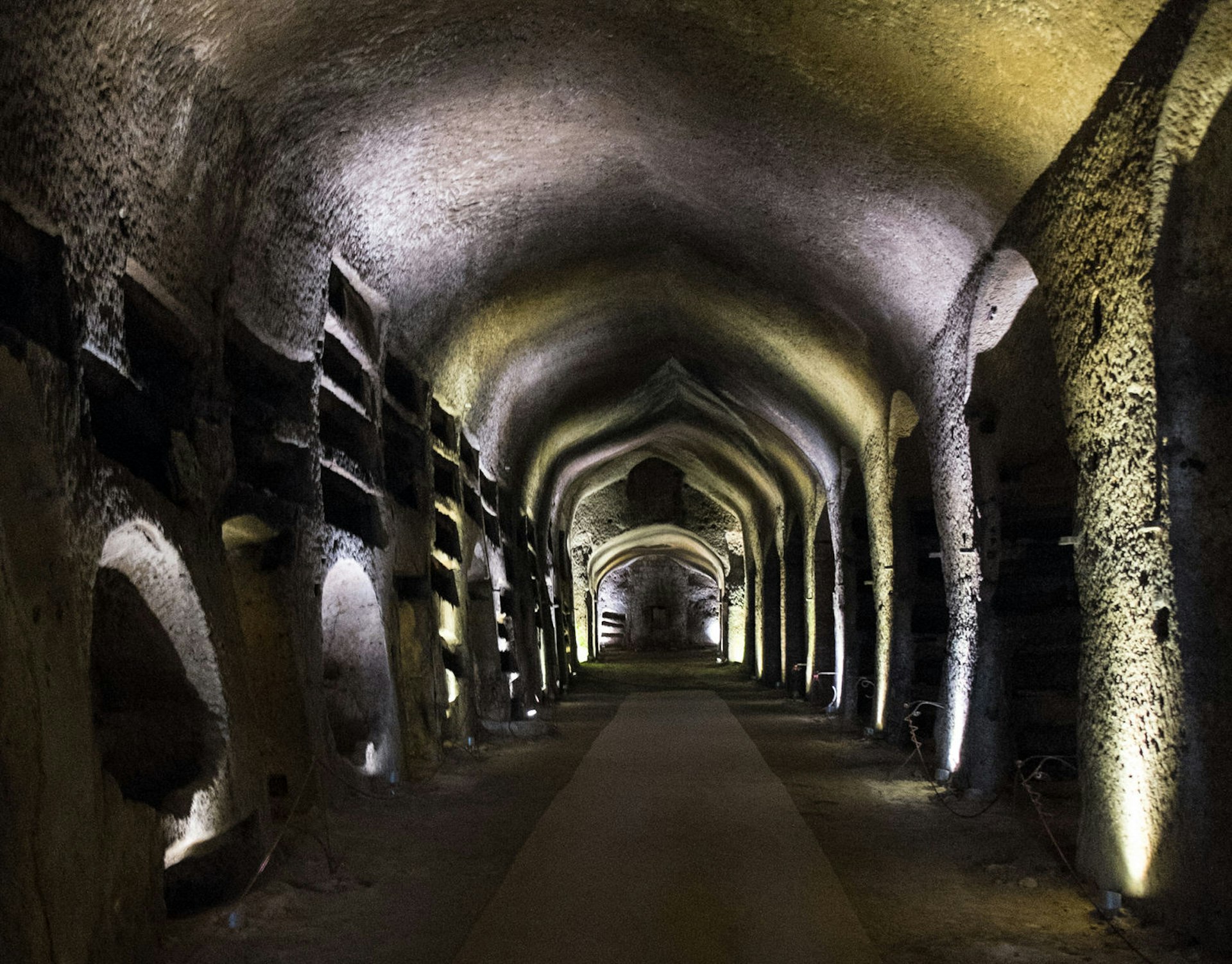 The illuminated tunnels of San Gennaro Catacombs