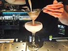 A barman preparing a cocktail at the Suicide Club © Paul Fitzpatrick / Lonely Planet