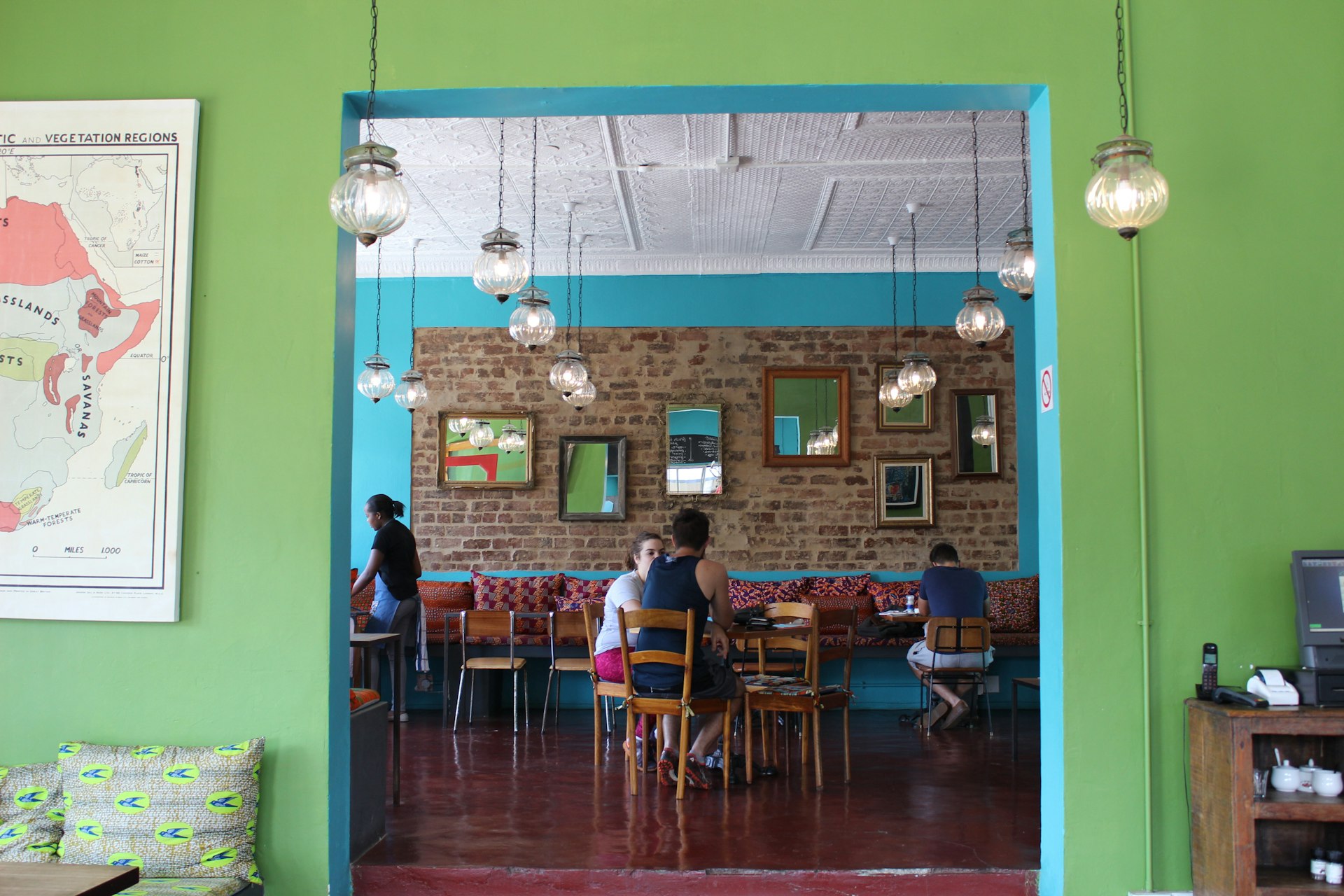 Brunch amongst colourful walls of African prints at Bread & Roses. © Jenali Skuse / Lonely Planet