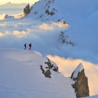 Two skiers look over Austria's biggest ski area © Lech Zürs Tourismus