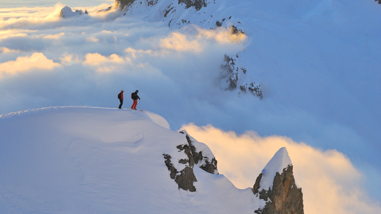Two skiers look over Austria's biggest ski area © Lech Zürs Tourismus