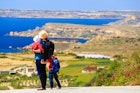Features - mother with two kids travel on scenic road