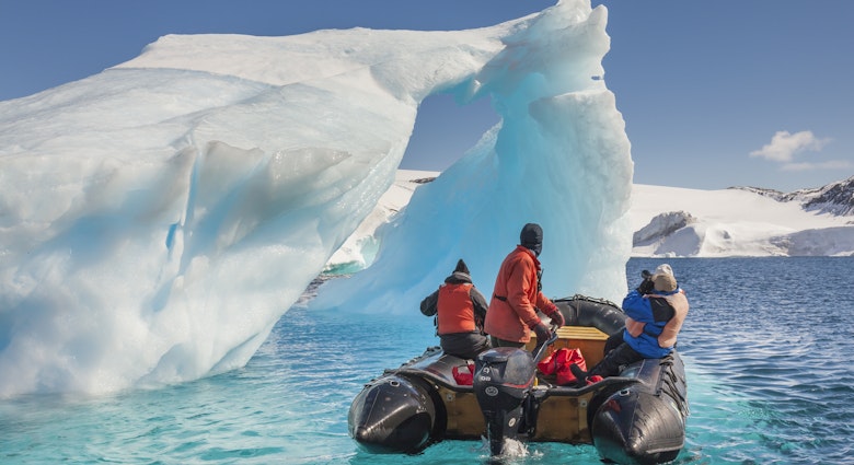 Features - Tourists view icebergs near Devil Island, northeast side of the Antarctic peninsula