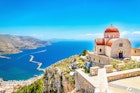 Features - Amazing view on remote church with red roofing on the Cliff of the sea, Greece