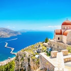 Features - Amazing view on remote church with red roofing on the Cliff of the sea, Greece