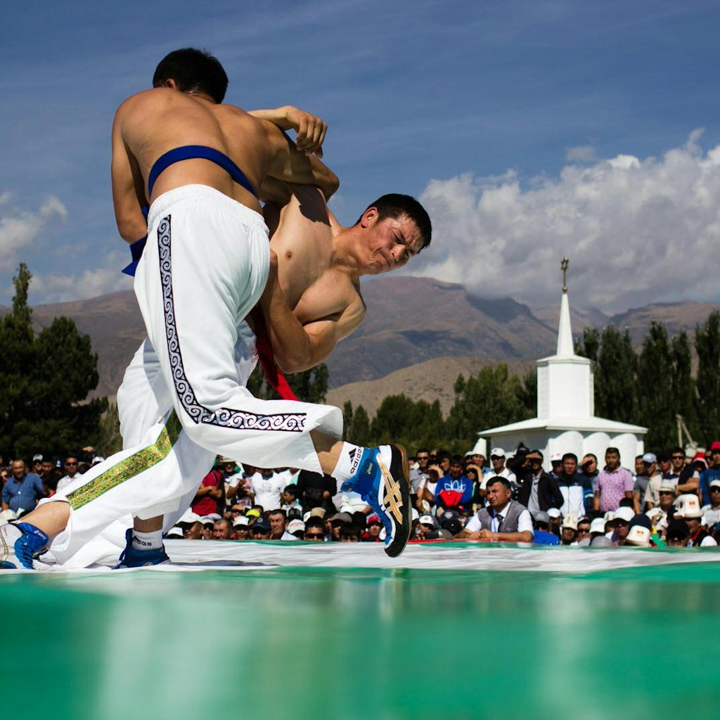 Kyrgyz Kurosh wrestlers fight for the win at the Rukh Ordo complex in Cholpon-Ata during the 2014 World Nomad Games in Kyrgyzstan © Stephen Lioy / Lonely Planet