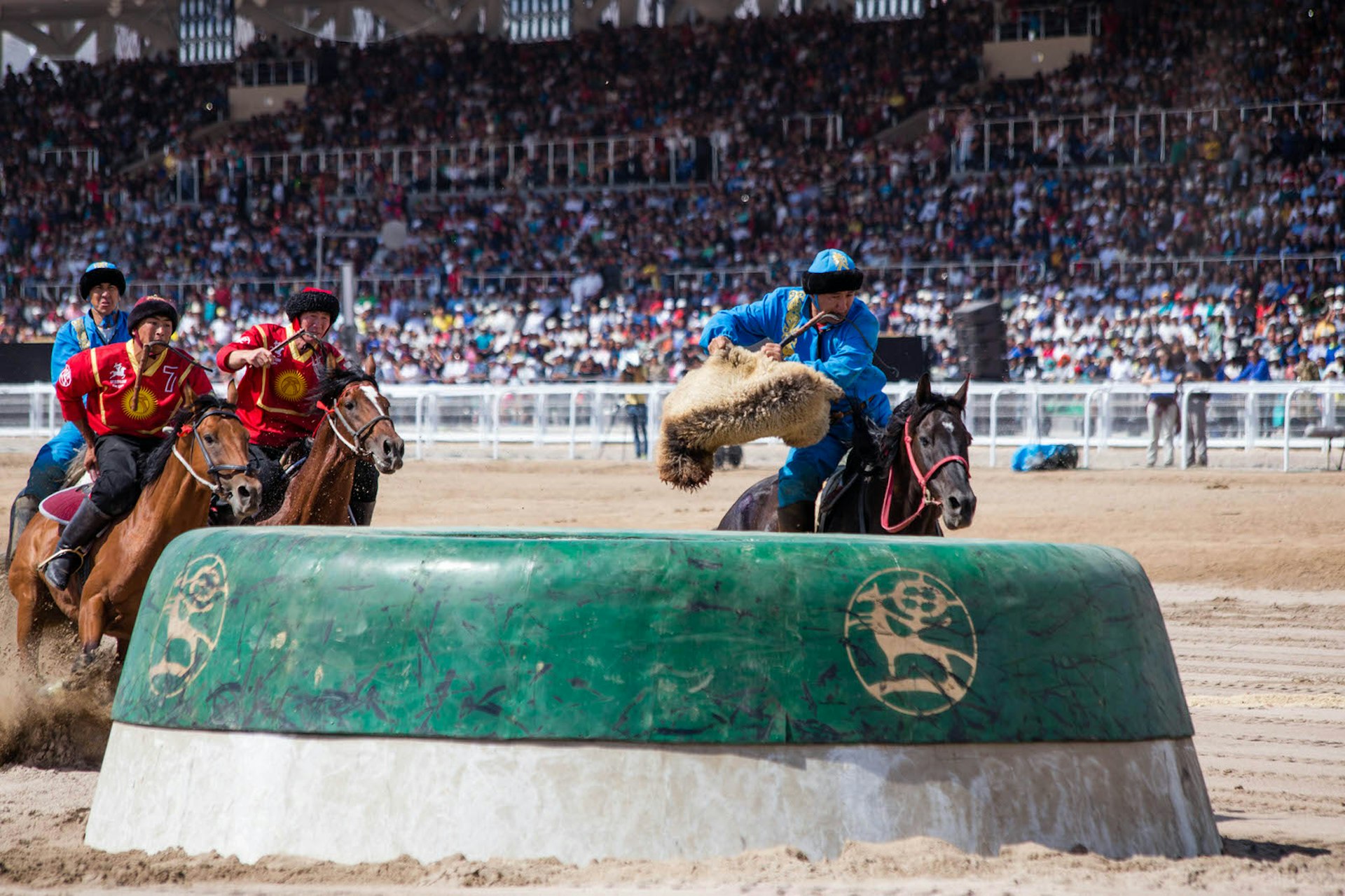 A Kazakh rider scores against the Kyrgyzstan team during the kok-boru finals at the 2016 World Nomad Games in Kyrgyzstan © Stephen Lioy / Lonely Planet