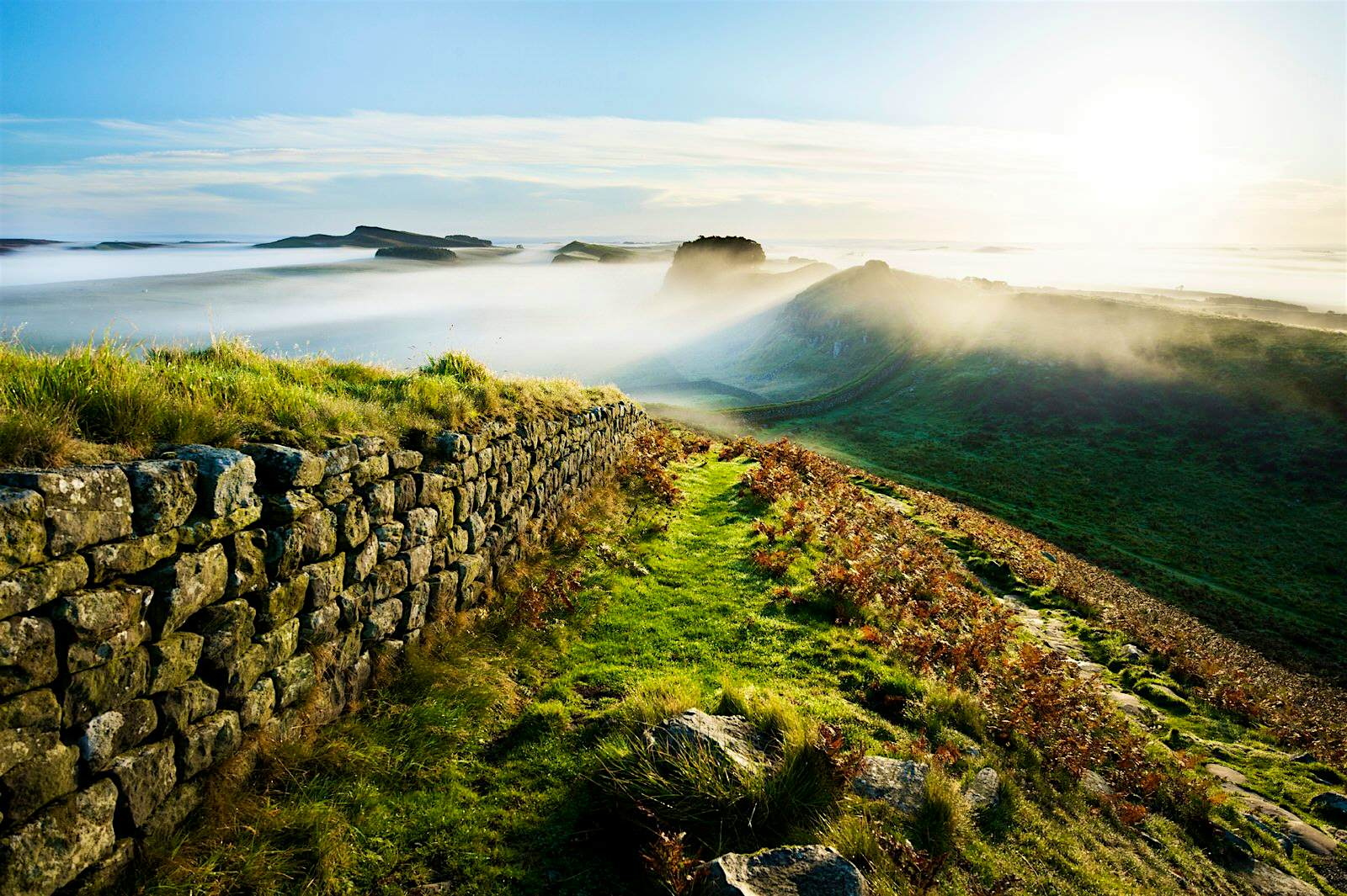 Features - Mist in valley at Hadrian's Wall seen from Cuddys Cragnear Housesteads Crag. Mist envelopes Hadrian's Wall at Cuddy's Crag. Some historians say Arthur fought his last battle nearby © Justin Foulkes / Lonely Planet