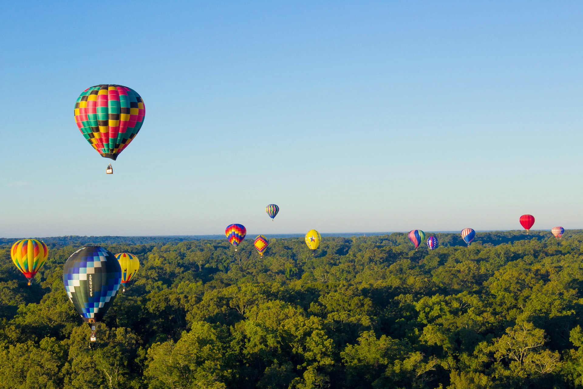 Hot air balloons float above Natchez for the Great Mississippi River Balloon Race © Natchez Convention and Visitors Bureau