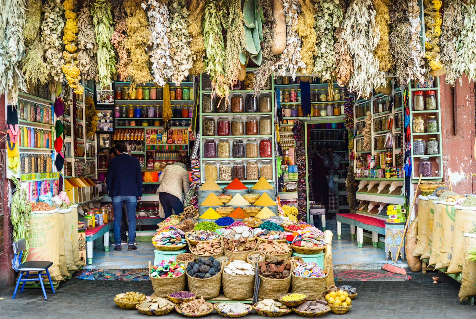 Shoppers survey the colourful local produce in Marrakesh, Morocco © A J Withey / Getty Images