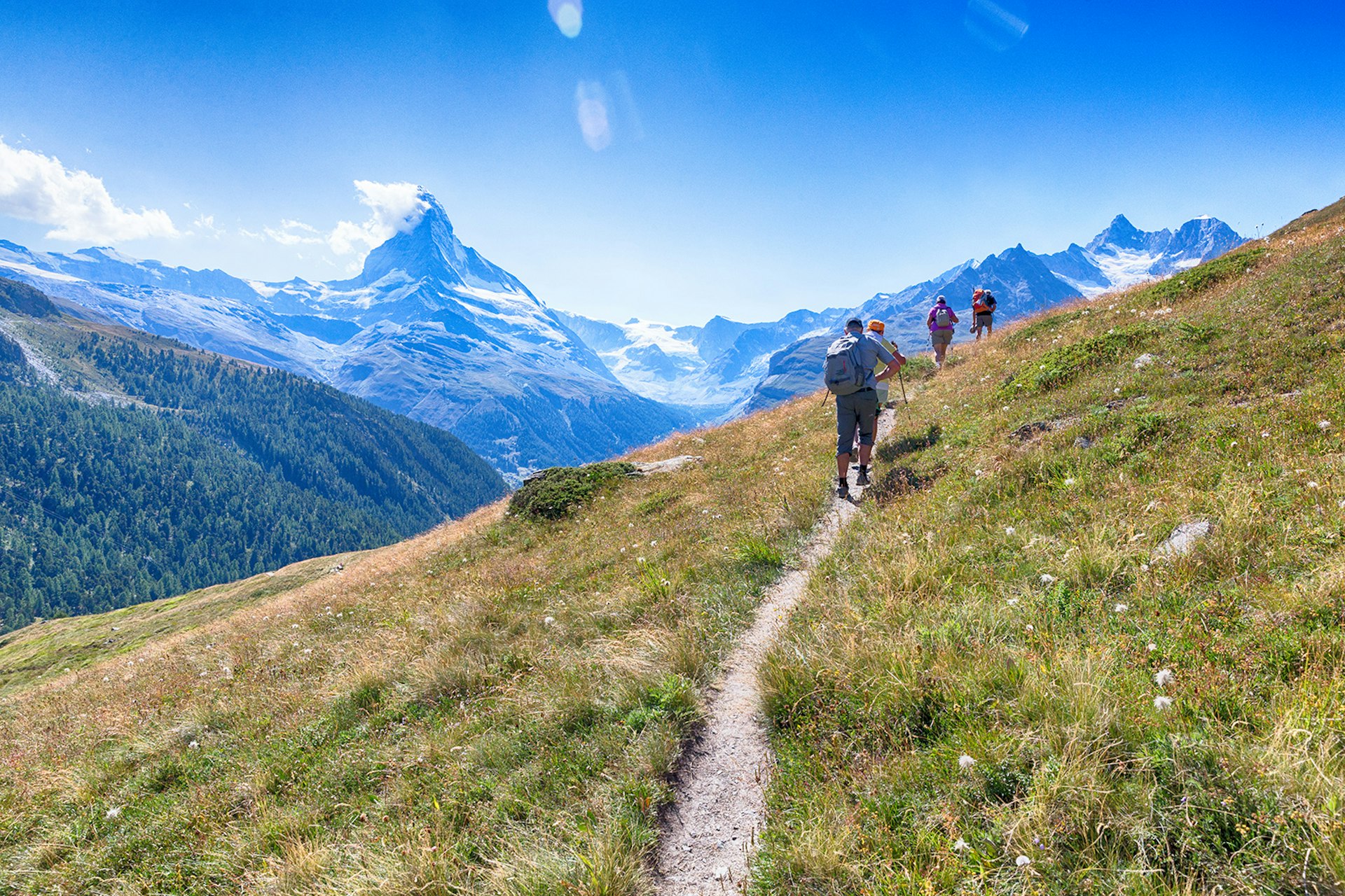 Features - Hikers On A Trail Towards the Matterhorn