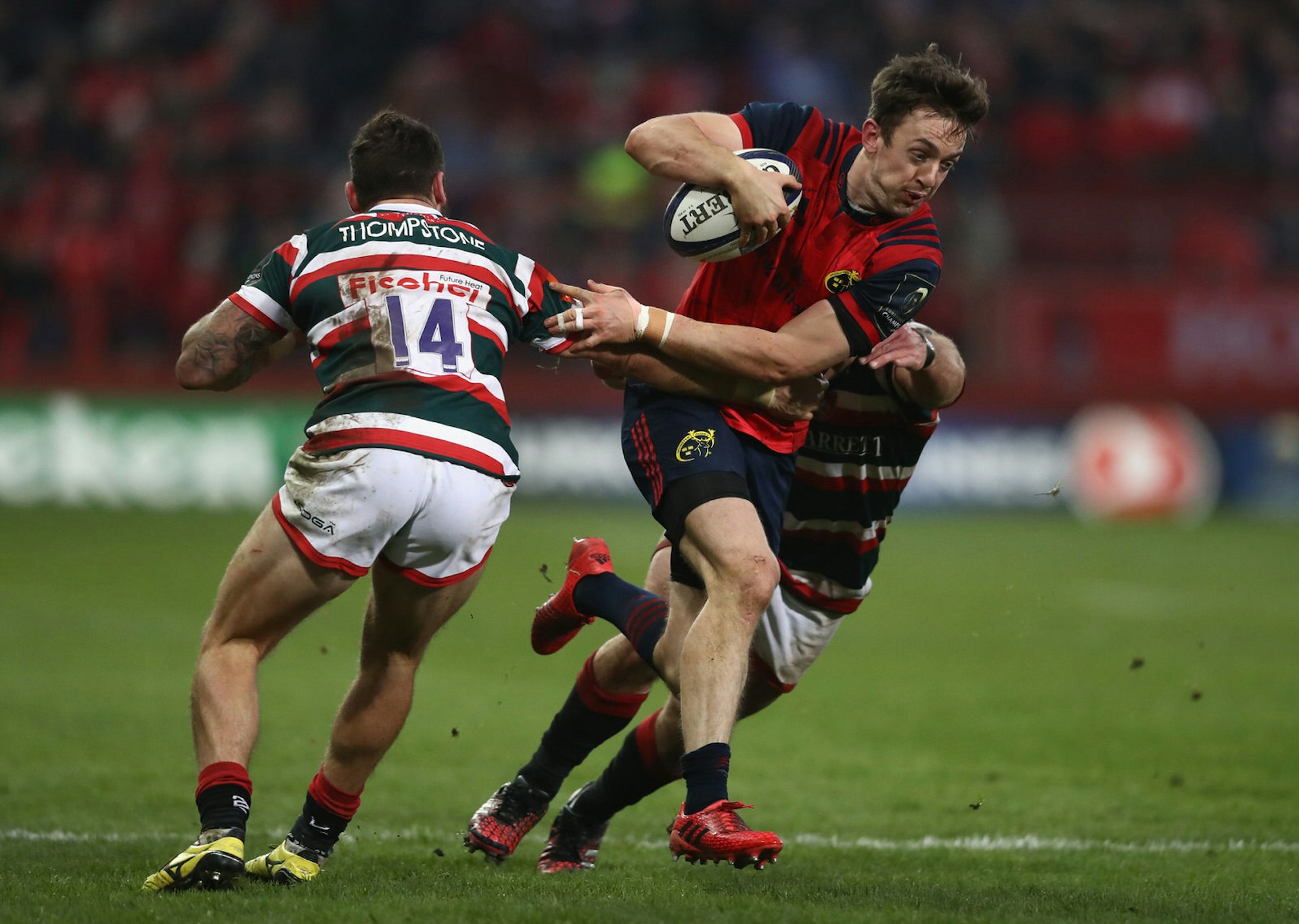 Darren Sweetnam of Munster bursts through Leicester Tigers' defensive line at Thomond Park © David Rogers/Getty Images