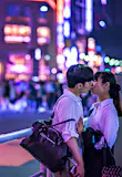 A couple kiss in Tokyo