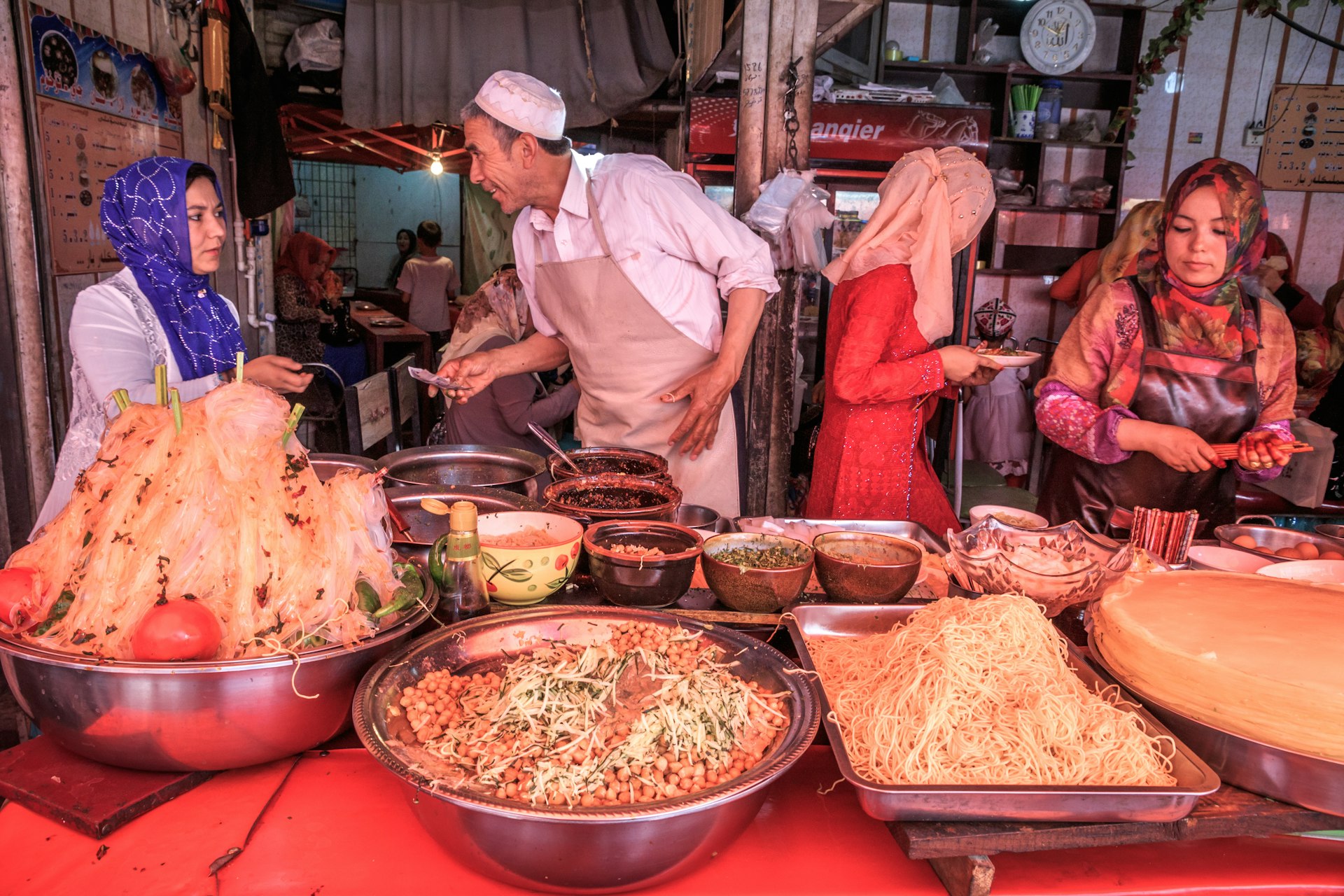 Vendors sell traditional foods at Kashgar's Grand Bazaar © Feng Wei Photography / Getty