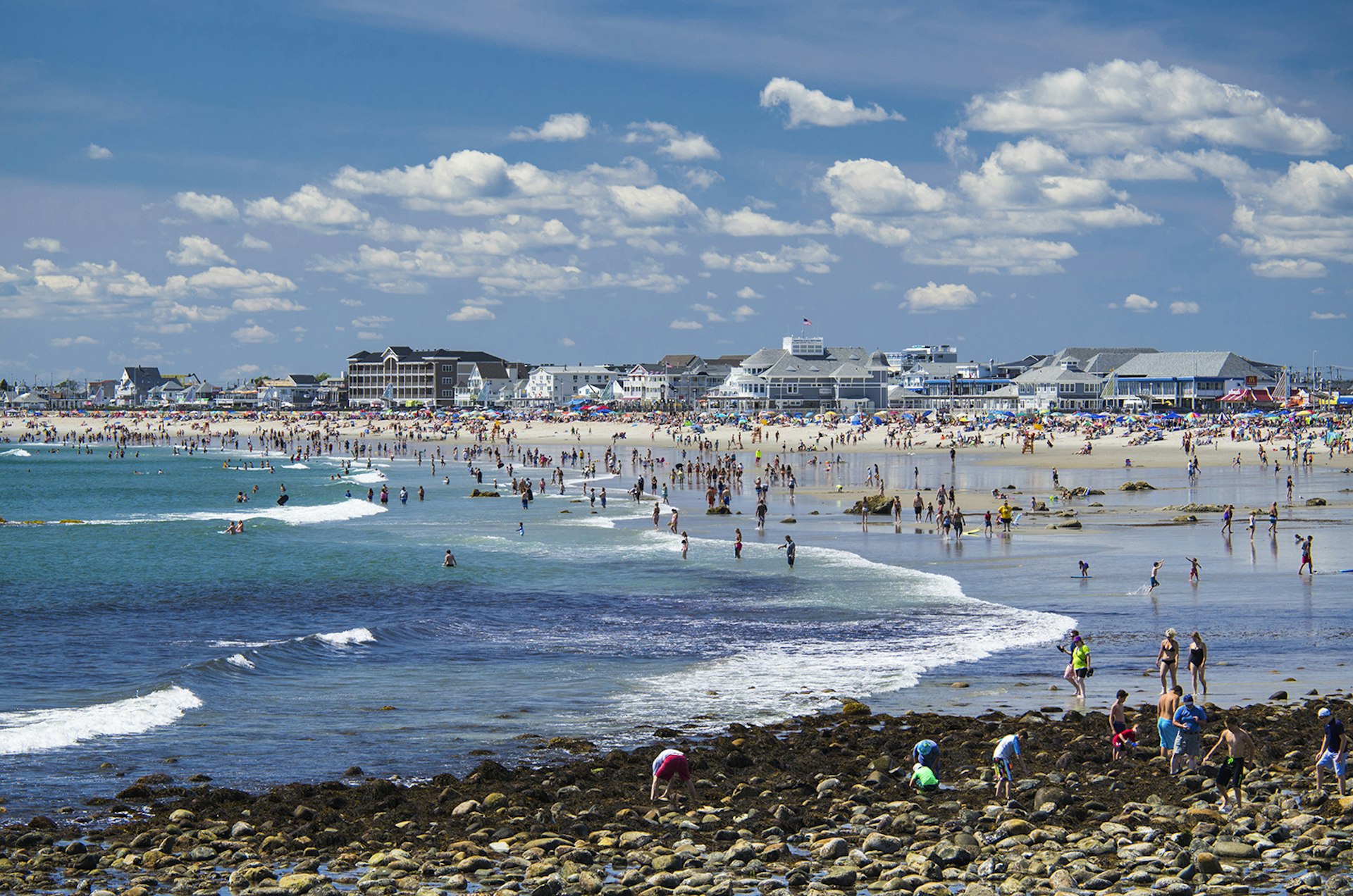 Features - People relaxing on sunny beach, Hampton Beach, New Hampshire, USA