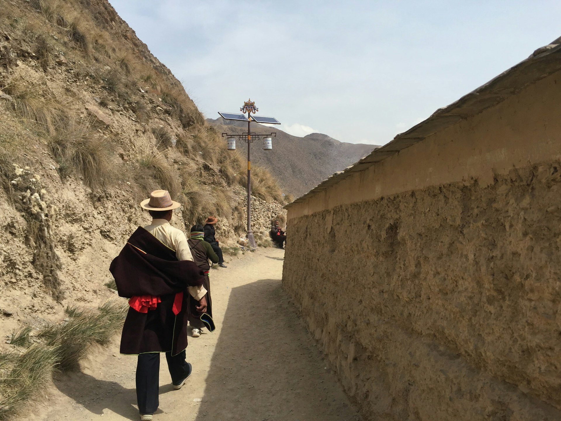 Tibetan pilgrims walk the inner kora path at Labrang Monastery in Xiahe © Megan Eaves / Lonely Planet