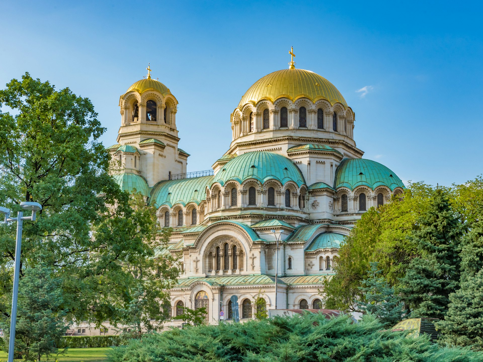 Two gold domes sit above a green roof of this cathedral in Sofia, Bulgaria
