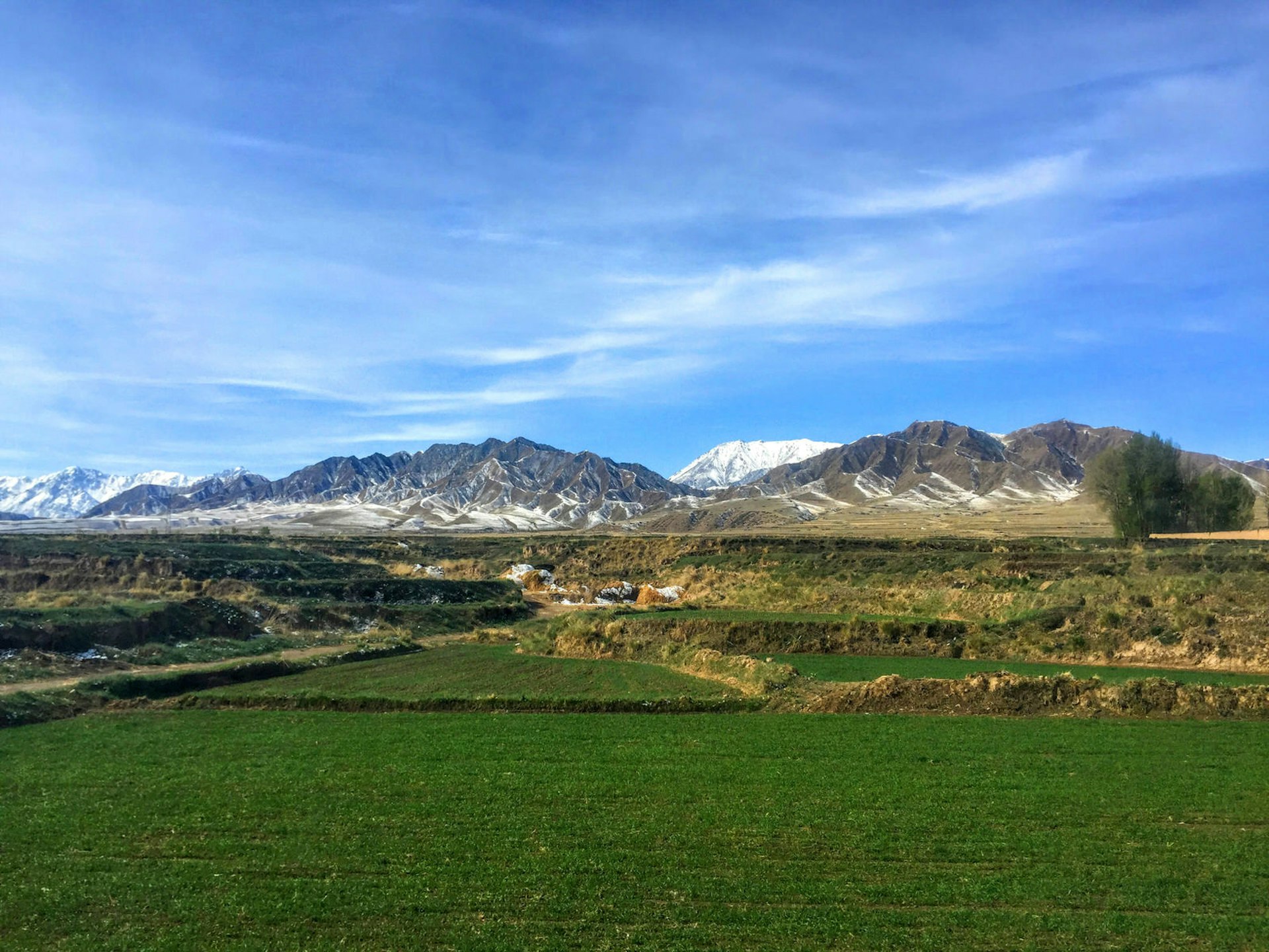 Qilian Mountains dusted by April snow, on the way to Mati Si © Megan Eaves / Lonely Planet