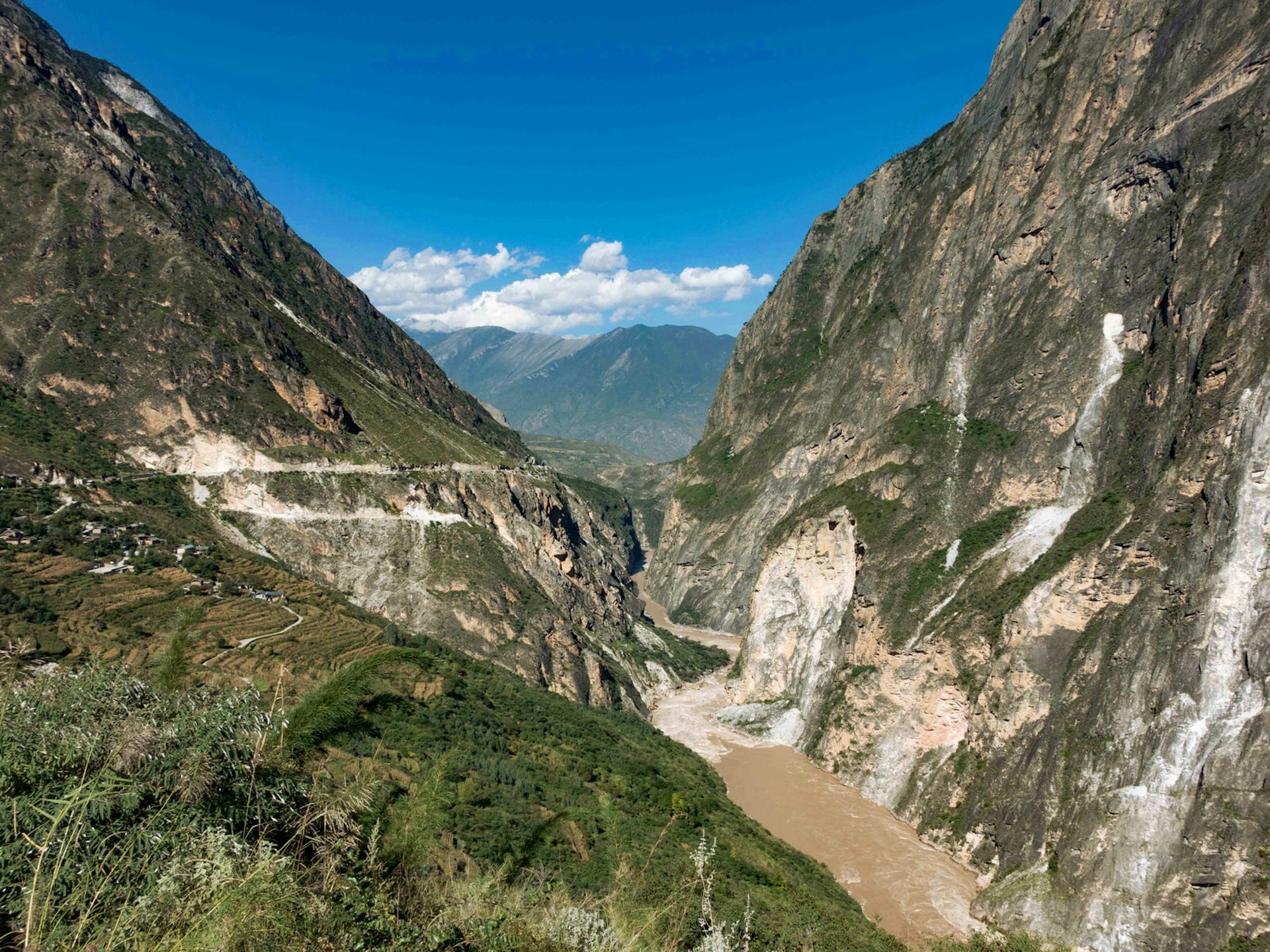 Hiking Tiger Leaping Gorge offers a scenic break from the saddle © Tess Humphrys / Lonely Planet