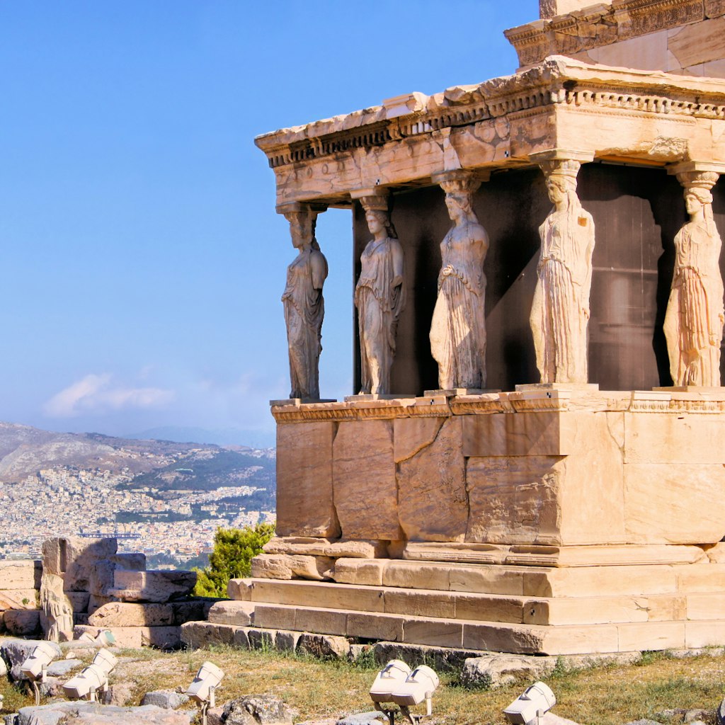 The Erechtheion temple's Caryatids overlooking Athens from the Acropolis © JeniFoto / Shutterstock