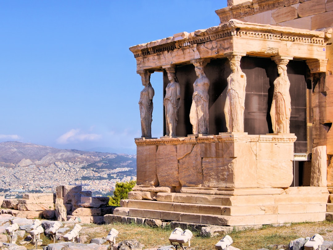 The Erechtheion temple's Caryatids overlooking Athens from the Acropolis © JeniFoto / Shutterstock