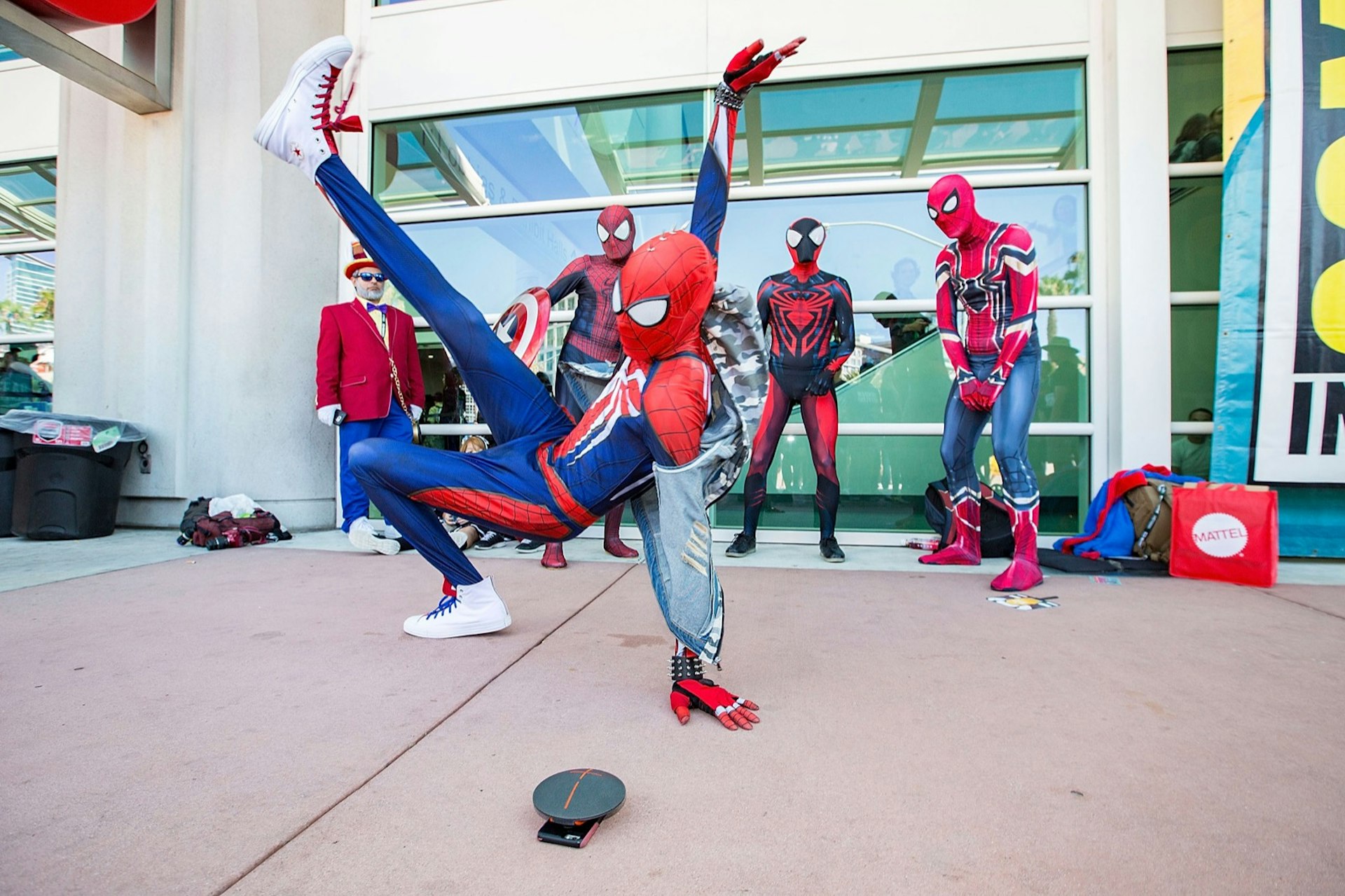 A group of breakdancers performs in Spiderman costumes at ComiCon in San Diego