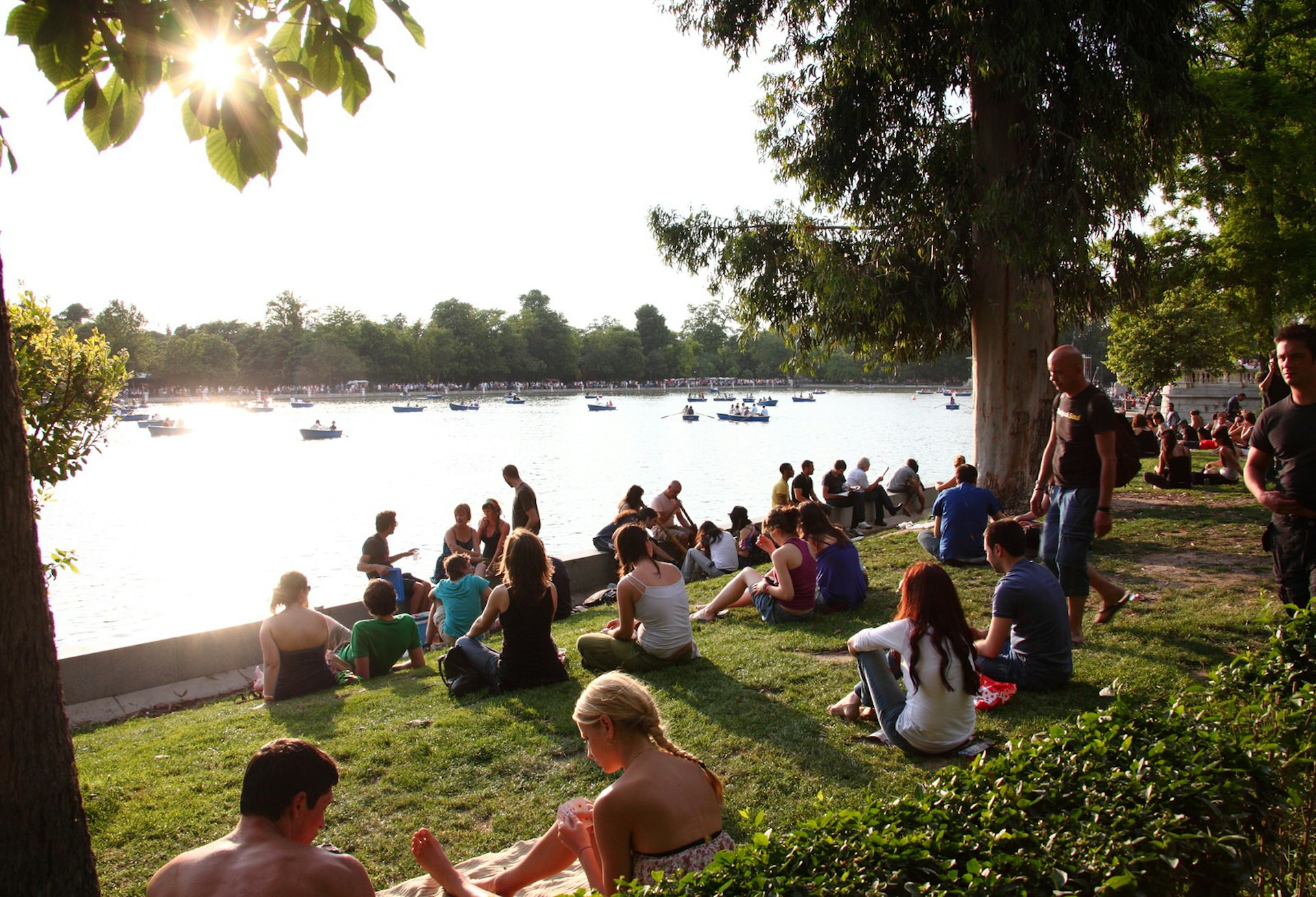 People enjoying the Parque del Retiro in Madrid, Spain